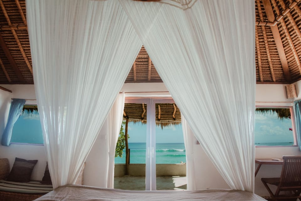 Deluxe Bungalow, Ocean View | Minibar, in-room safe, soundproofing, bed sheets