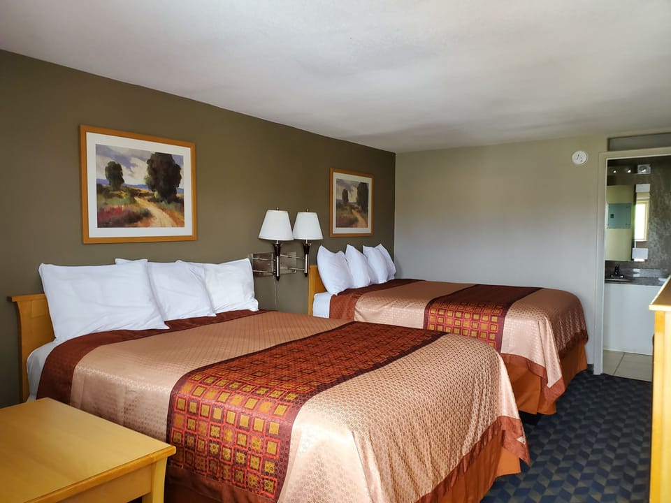Pillowtop beds, blackout drapes, free WiFi, bed sheets