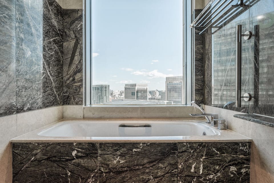 Executive Room, 1 King Bed | Bathroom | Separate tub and shower, rainfall showerhead, designer toiletries