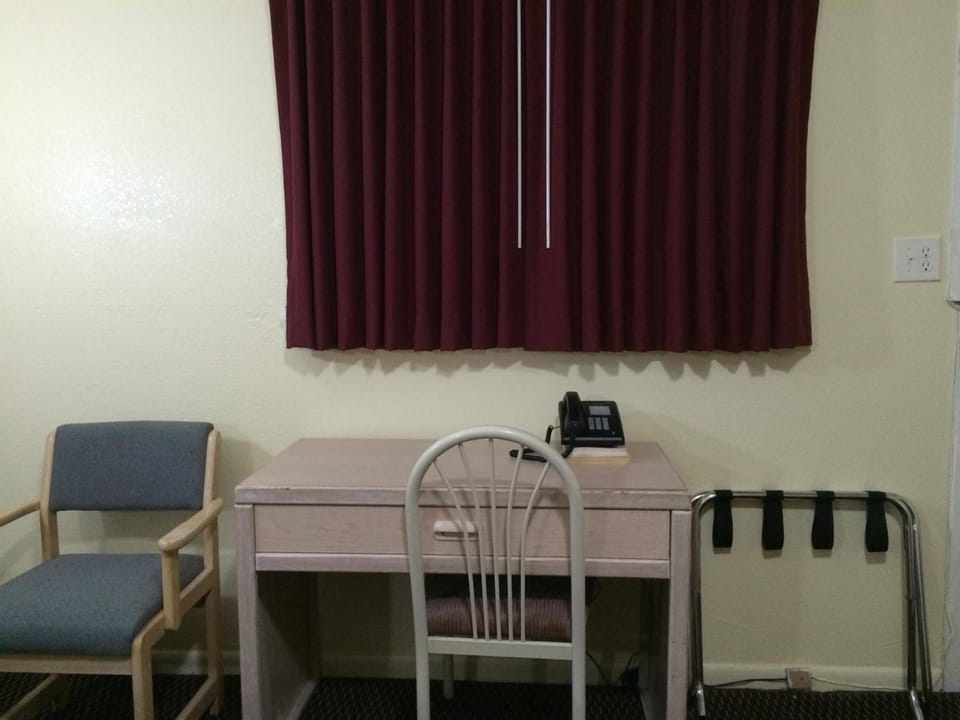 Desk, blackout drapes, iron/ironing board, free cribs/infant beds