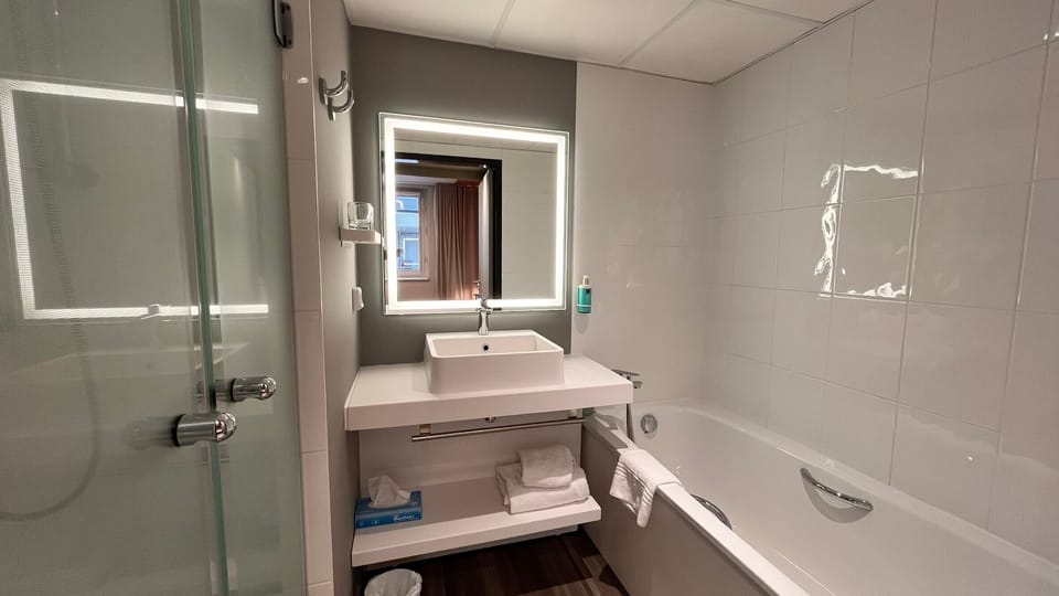 Separate tub and shower, eco-friendly toiletries, hair dryer, towels