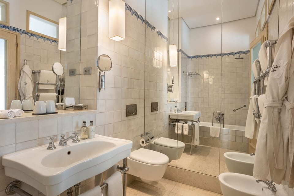Combined shower/tub, designer toiletries, hair dryer, bathrobes