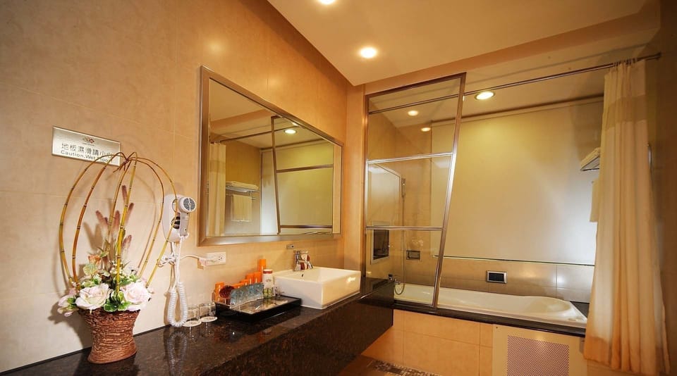 Shower, free toiletries, hair dryer, slippers