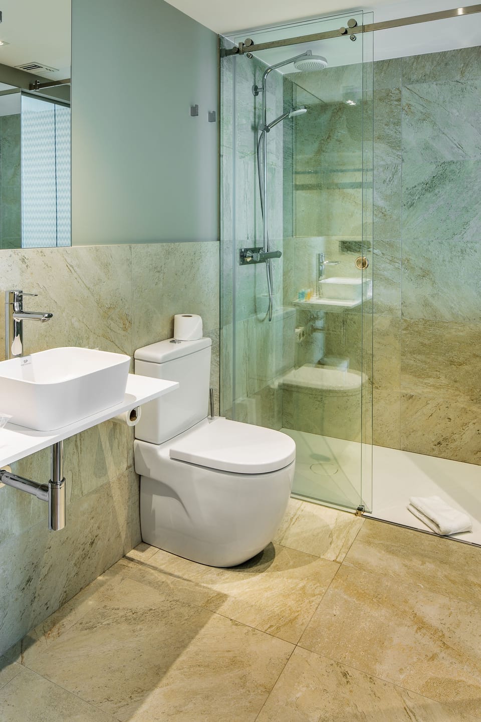 Shower, eco-friendly toiletries, hair dryer, towels