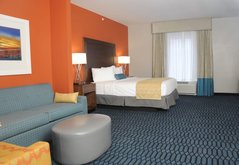 Deluxe Suite, 1 King Bed (The Lodge) | Premium bedding, pillowtop beds, blackout drapes, iron/ironing board