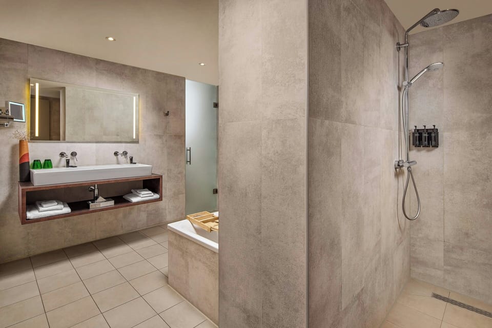 Rainfall showerhead, designer toiletries, hair dryer, towels