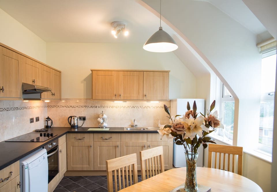 Luxury Apartment, Ensuite, River View (Edgecombe (2 Bedrooms)) | Private kitchen | Highchair