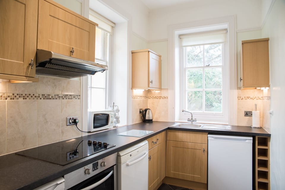 Premier Apartment, Ensuite, Sea View (Seymour (2 Bedrooms)) | Private kitchen | Highchair