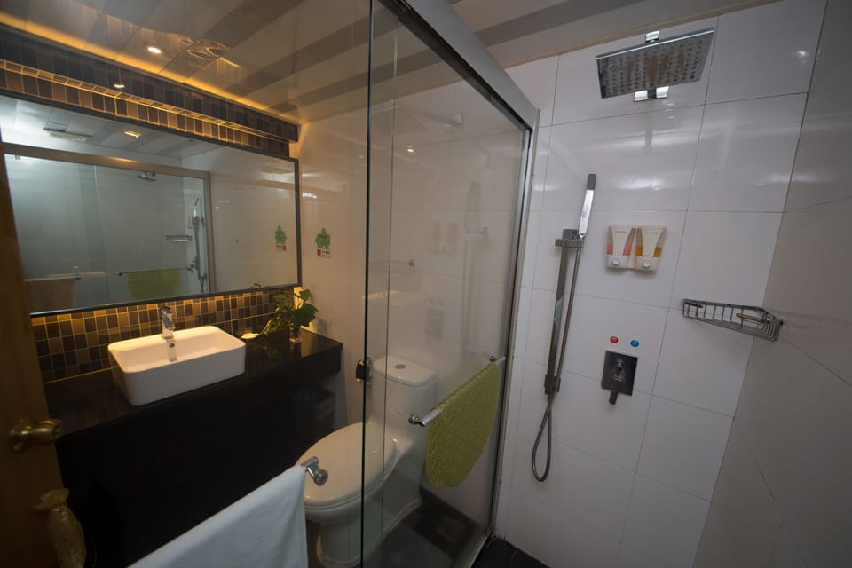 Shower, free toiletries, hair dryer, slippers