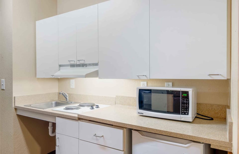 Deluxe Studio, 1 Queen Bed with Sofa bed, Accessible, Non Smoking | Private kitchen | Full-size fridge, microwave, stovetop, dishwasher
