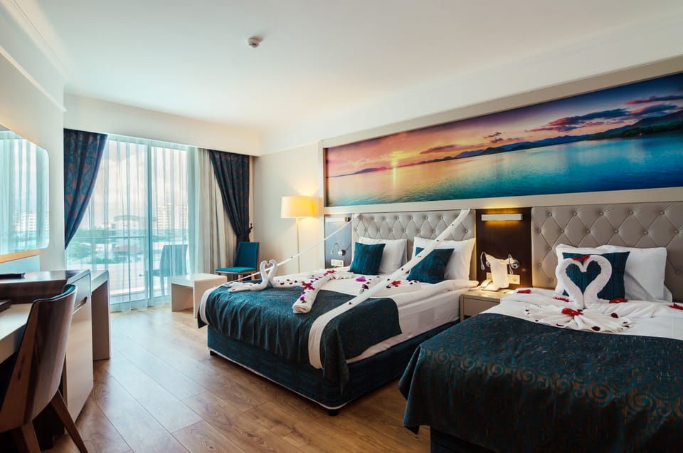 Premium bedding, free minibar items, in-room safe, desk