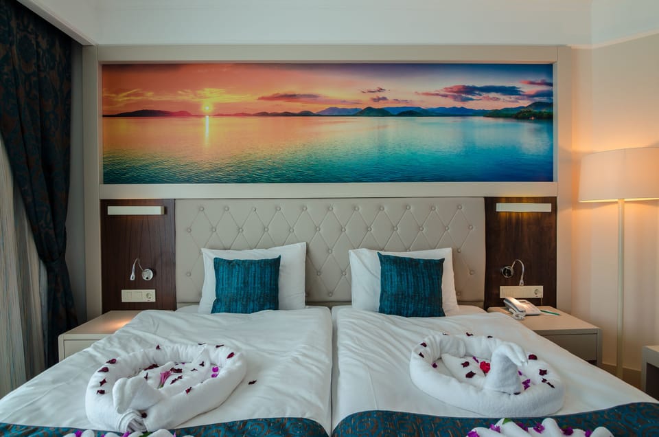 Premium bedding, free minibar items, in-room safe, desk