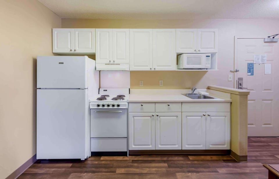 Fridge, microwave, stovetop, coffee/tea maker