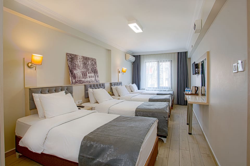 Family Room | Premium bedding, minibar, in-room safe, desk