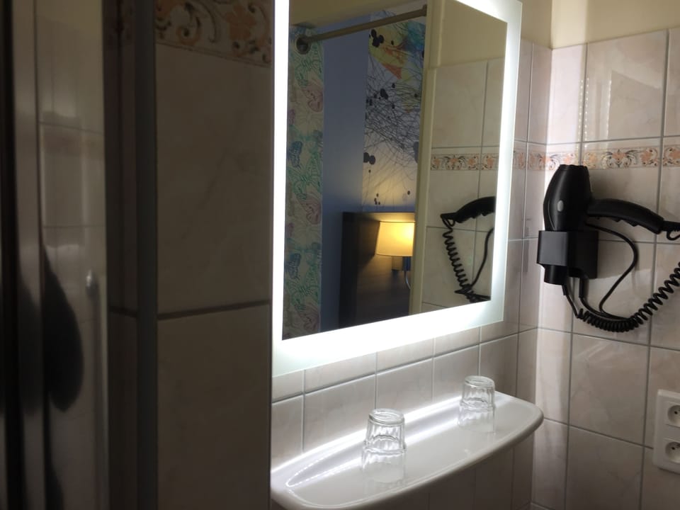 Shower, designer toiletries, hair dryer, towels