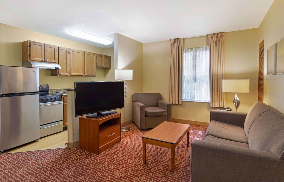 Suite, 2 Bedrooms, Non Smoking, Refrigerator & Microwave | Desk, laptop workspace, blackout drapes, iron/ironing board