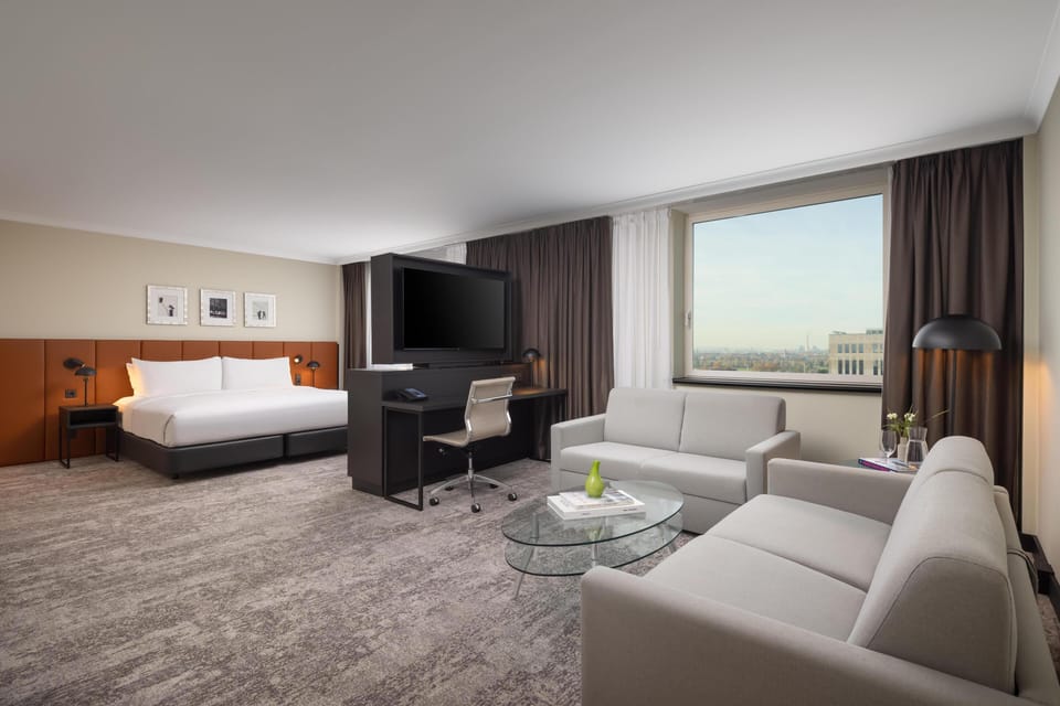 Junior Suite, 1 King Bed | Living area | 55-inch LCD TV with cable channels