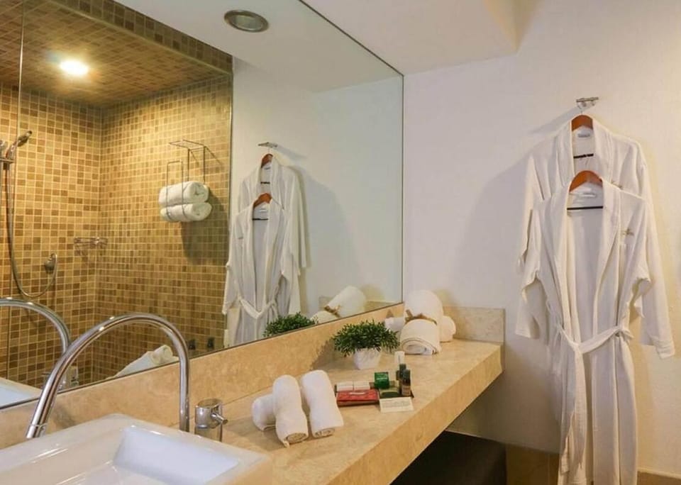 Shower, designer toiletries, hair dryer, bathrobes