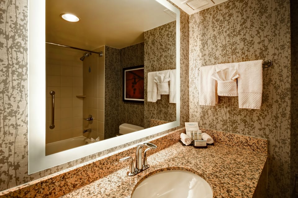 Designer toiletries, hair dryer, bathrobes, towels