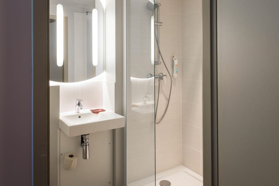 Shower, eco-friendly toiletries, hair dryer, towels