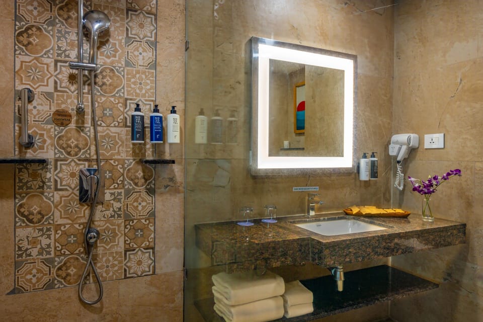 Shower, eco-friendly toiletries, hair dryer, bathrobes