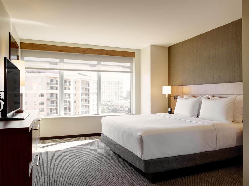 Hypo-allergenic bedding available, down comforters, in-room safe, desk
