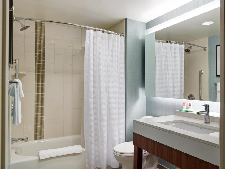 Room, 2 Queen Beds (W/Sofabed) | Bathroom | Free toiletries, hair dryer, towels, soap