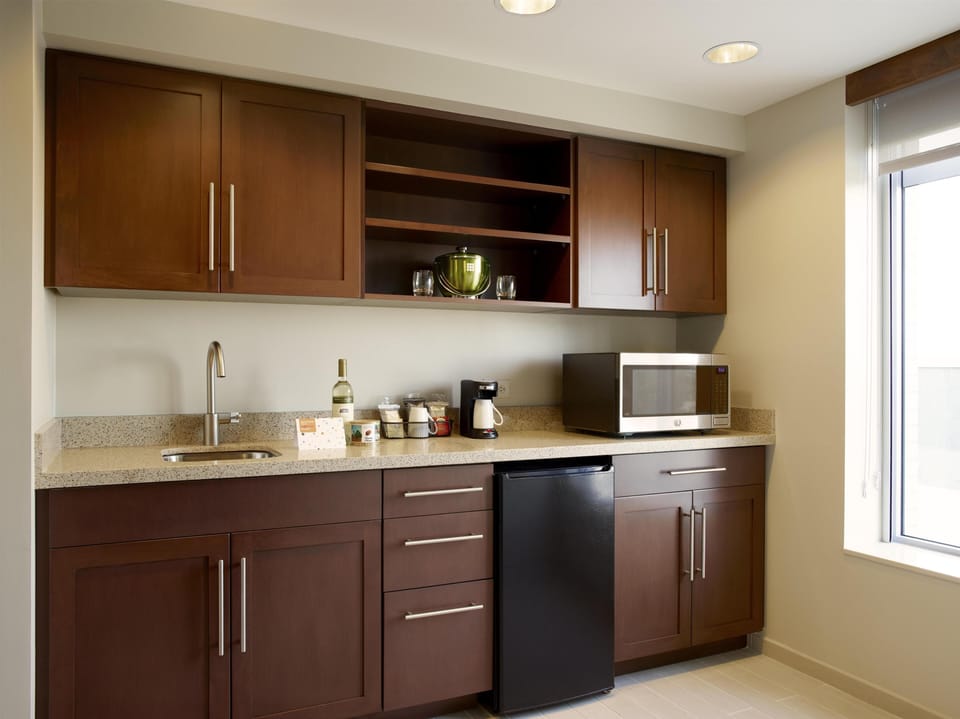 Coffee/tea maker, mini-fridge, shared microwave, highchair