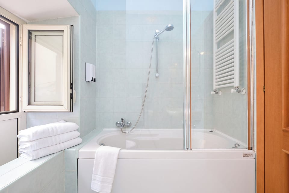 Family Quadruple Room | Bathroom | Shower, free toiletries, hair dryer, bidet