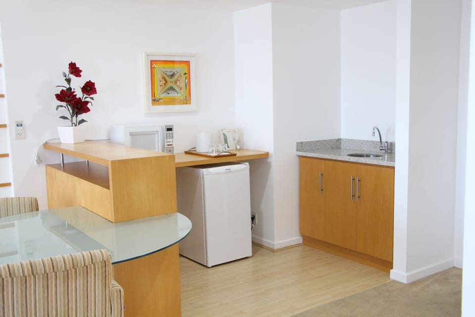 Suite, 1 King Bed, Partial Sea View | Minibar, in-room safe, blackout drapes, soundproofing