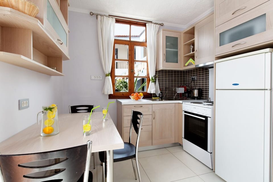 Family Apartment, 2 Bedrooms, Balcony | Private kitchen | Full-size fridge, microwave, oven, stovetop