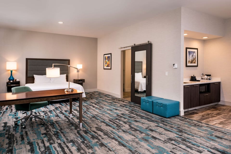 Suite, 1 King Bed, Accessible, Non Smoking (Roll In Shower) | Desk, blackout drapes, iron/ironing board, free cribs/infant beds