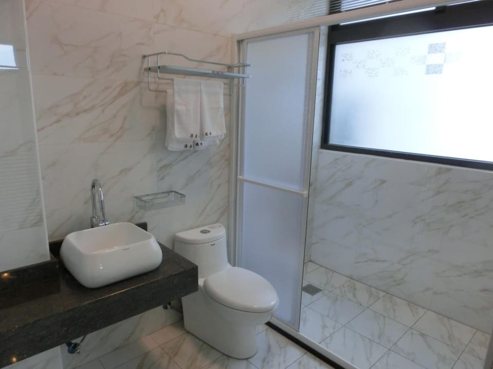 Shower, free toiletries, hair dryer, slippers