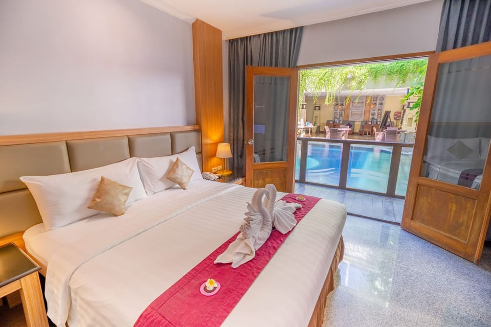 Deluxe Pool Access | Minibar, in-room safe, desk, blackout drapes