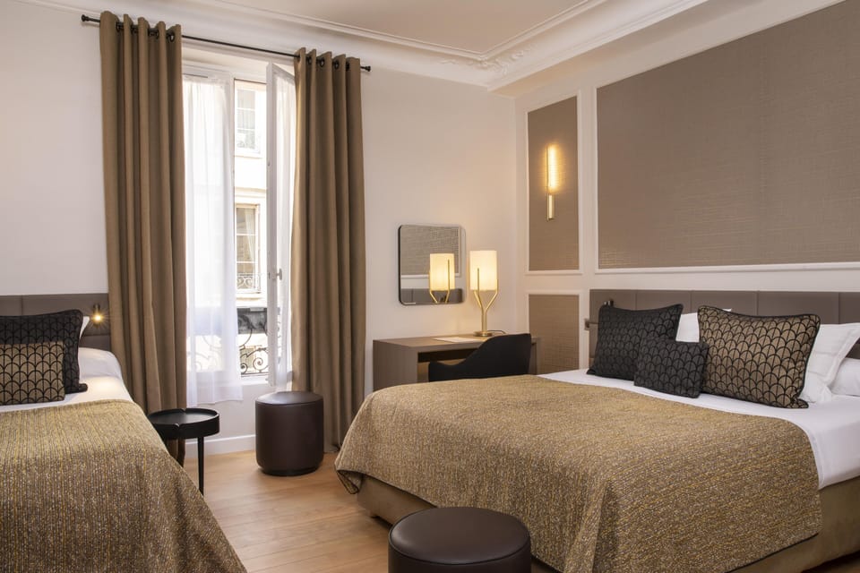 Triple Room | Minibar, in-room safe, desk, blackout drapes