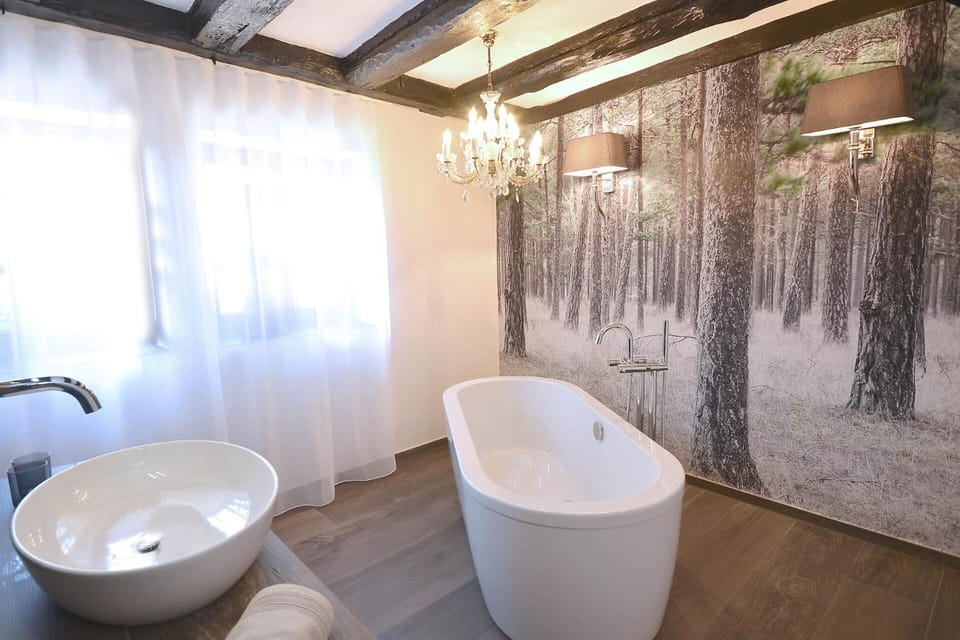 Junior Studio Suite, 1 King Bed, Patio, Garden View | Bathroom | Separate tub and shower, hair dryer, towels