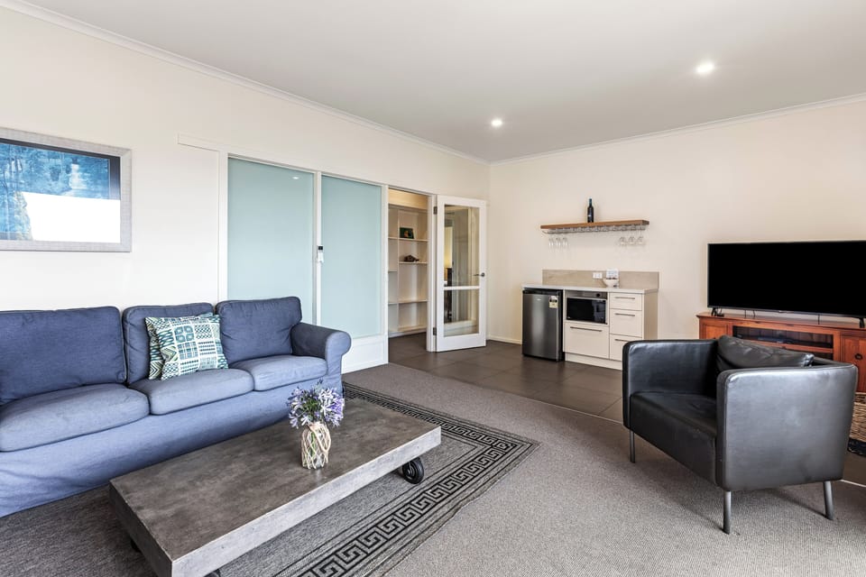 Three Bedroom Top Deck Apartment | Living area | 43-inch Smart TV with digital channels, Netflix, books