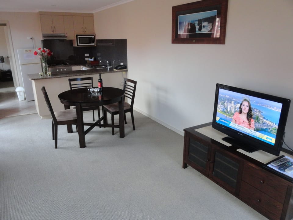 Standard Apartment, 1 Bedroom | Living room | 42-inch LCD TV with satellite channels, TV, DVD player