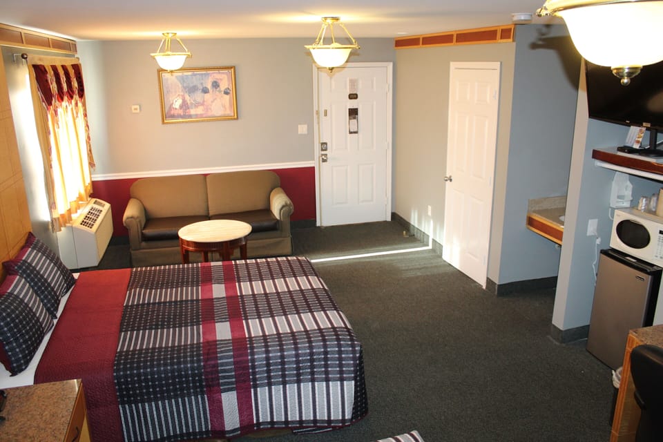 Premium bedding, desk, laptop workspace, blackout drapes