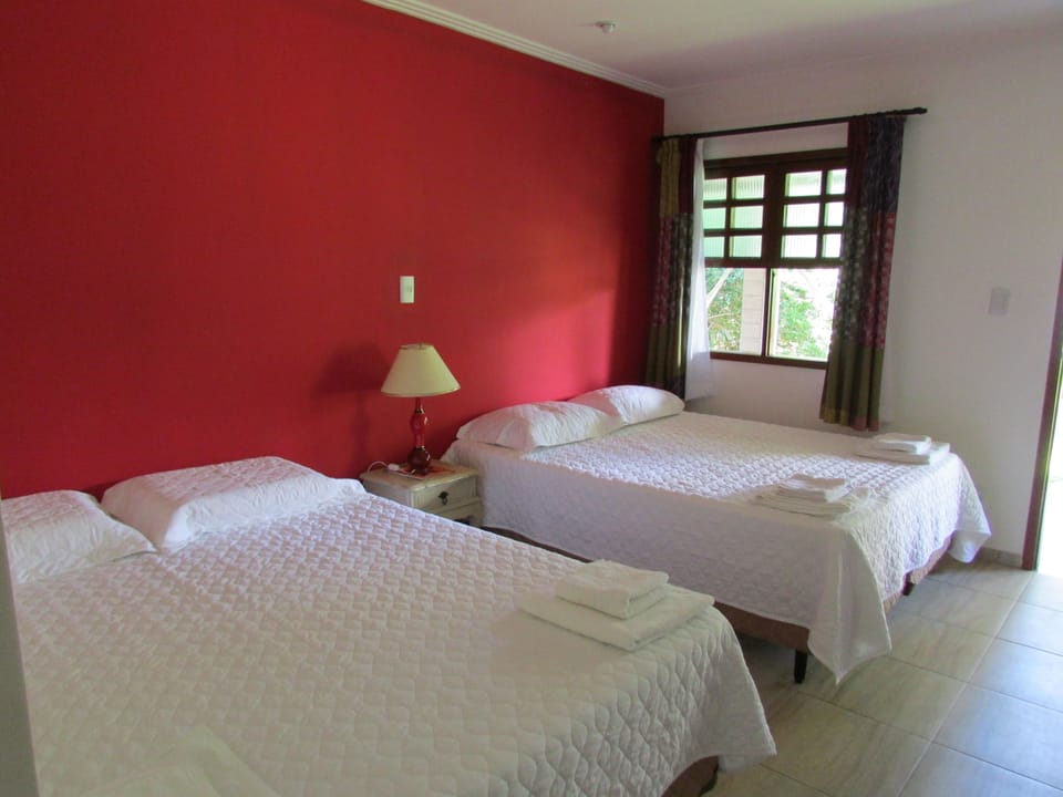 Standard Quadruple Room, Balcony | Minibar, individually decorated, individually furnished, desk