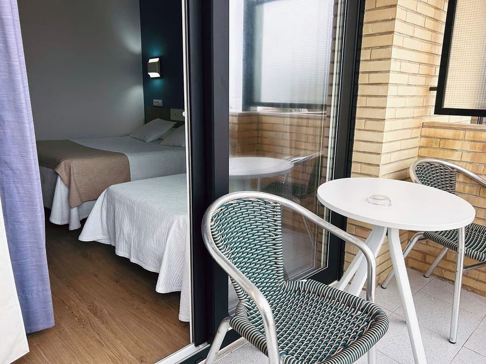 Triple Room, Sea View | In-room safe, desk, laptop workspace, blackout drapes