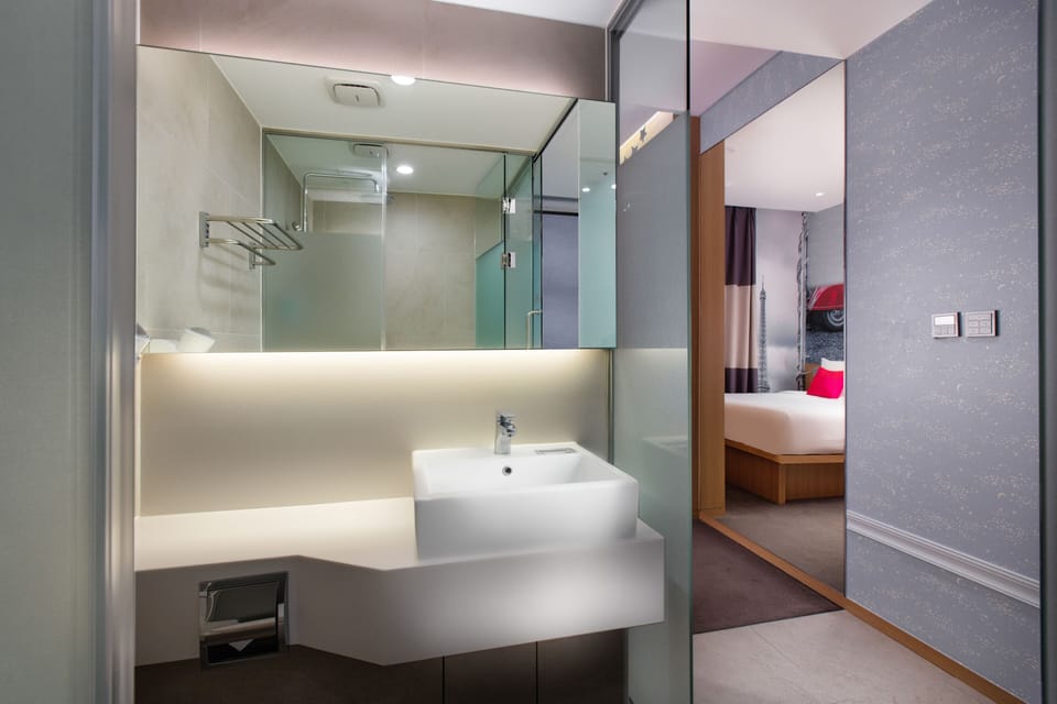 Shower, hair dryer, slippers, towels