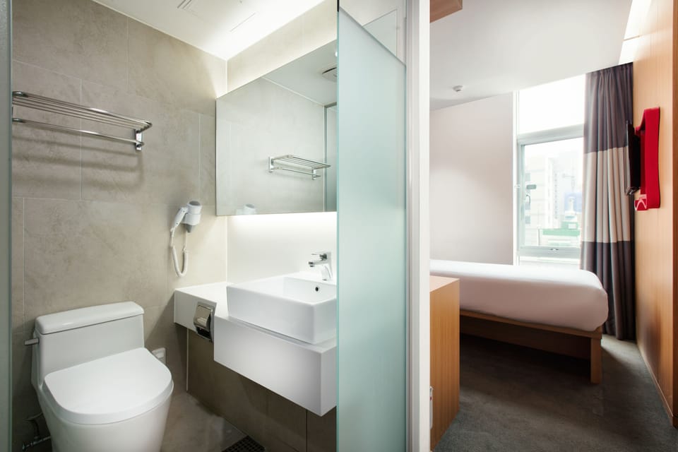 Shower, hair dryer, slippers, towels