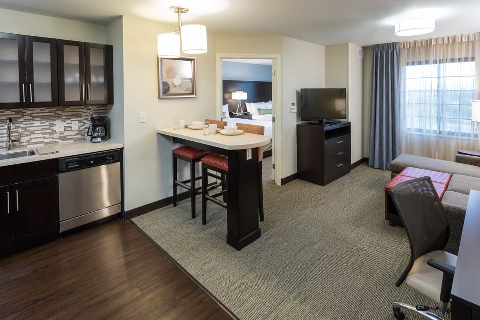 Suite, 1 Bedroom, Kitchen | 1 bedroom, desk, laptop workspace, iron/ironing board
