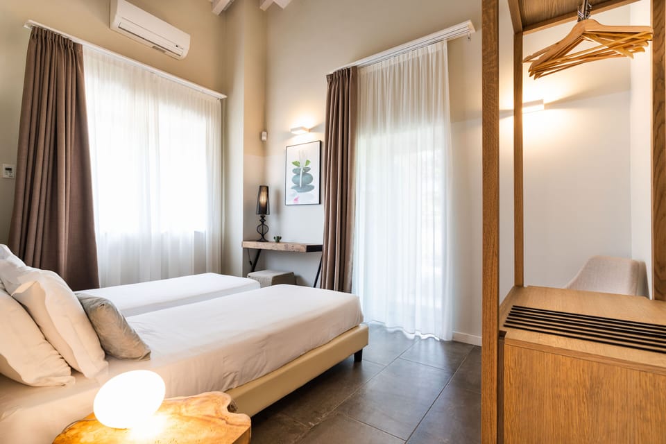 Family Suite, 2 Bedrooms, Garden Area | Minibar, in-room safe, individually decorated, individually furnished