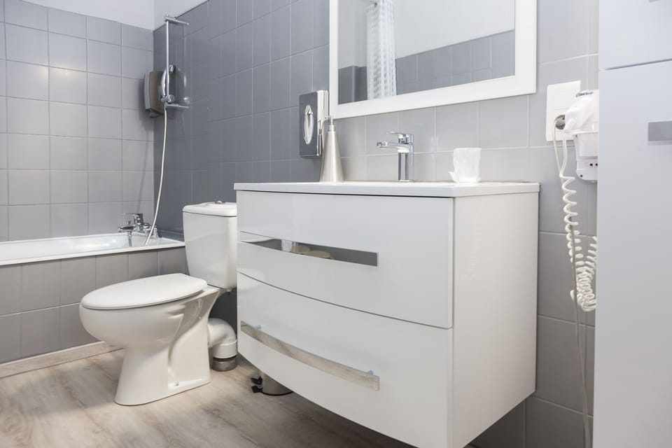 Family Quadruple Room, Bathtub, Mezzanine | Bathroom | Deep soaking tub, free toiletries, hair dryer, towels