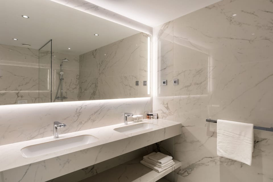 Shower, hair dryer, slippers, towels