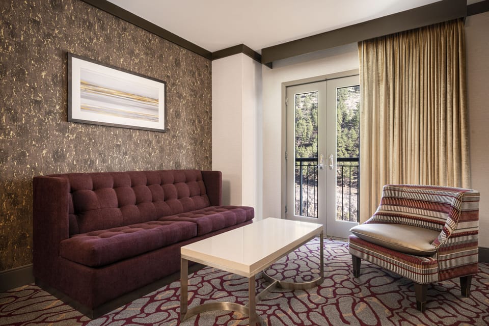 Junior Suite, 1 King Bed | Living area | 32-inch LCD TV with cable channels, TV, pay movies