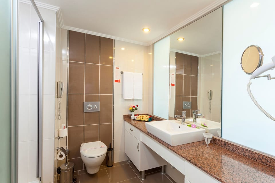Shower, eco-friendly toiletries, hair dryer, towels