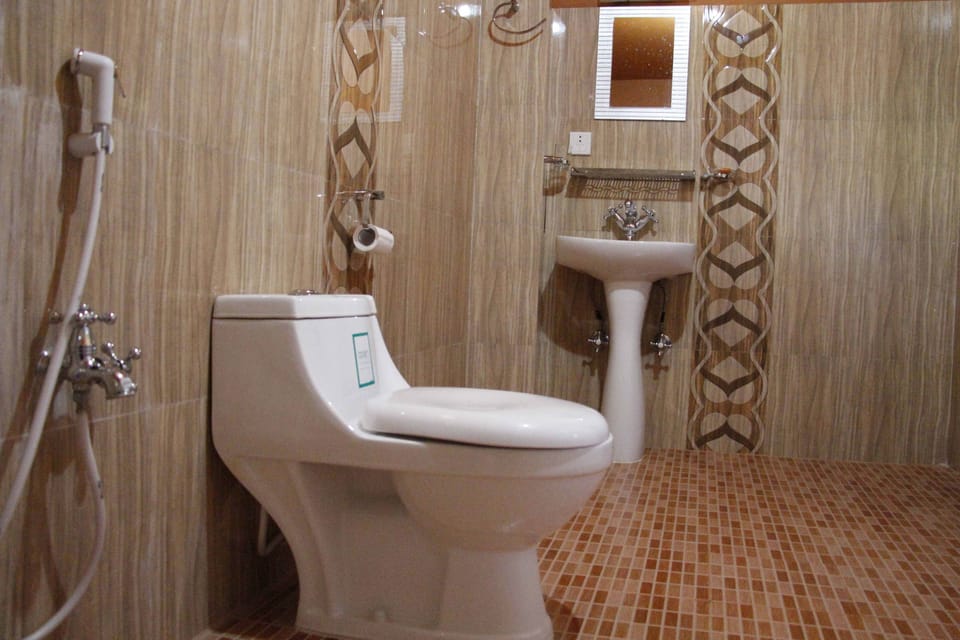Shower, free toiletries, slippers, towels